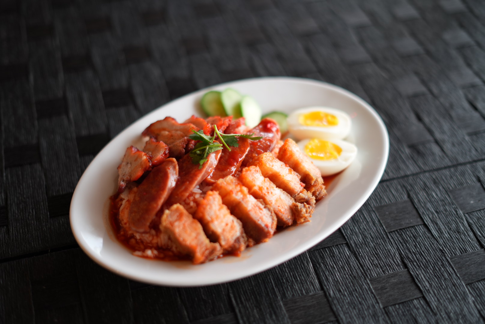 Crispy pork and Thai barbecue pork over rice at Bangkok at Beltline